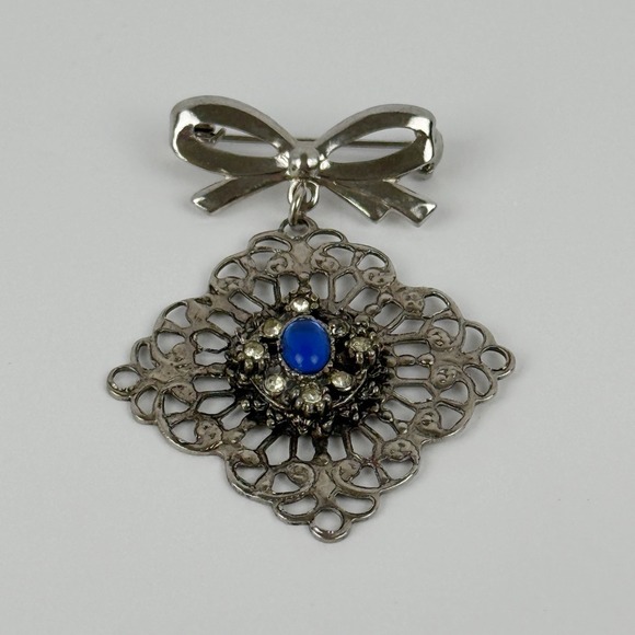 Filigree Jewelry - Vintage Silver Tone Bow Dangle Brooch Filigree Blue Cabochon Rhinestones